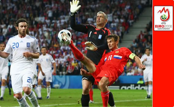 Greece v Russia - Sergei Semak flicks the ball back into the mix after Nikopolidis unnecessarily runs out to block the cross