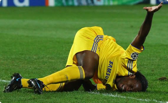 Drogba lies in agony awaiting assistance on a probable groin injury