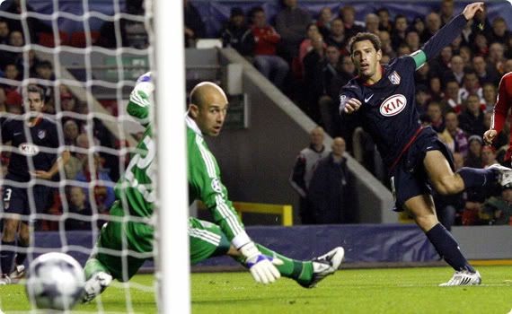 Maxi scores the opening goal as Liverpool keeper Pepe Reina watches the ball enter the net