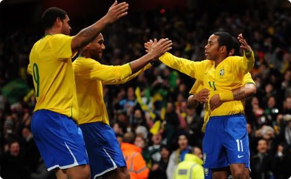 Brazil celebrate their dominance of Italy and Robinho's fine goal
