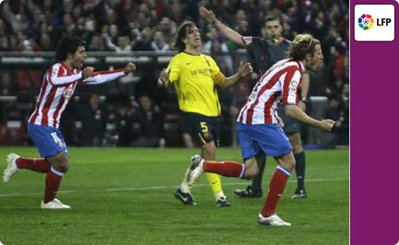Diego Forlan scored a brace to help Atletico beat Barcelona and heap more pressure on the league leaders