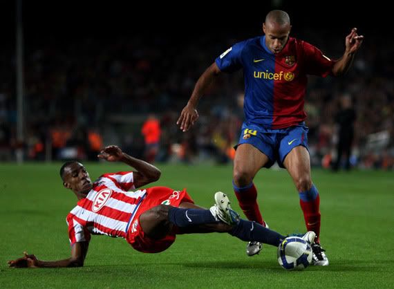 Thierry Henry prances around the Altetico defense