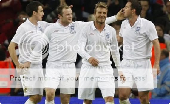 England looking sharp in their all-white number... is it just me or is Lamps about to erotically start licking Rooney's fingers?